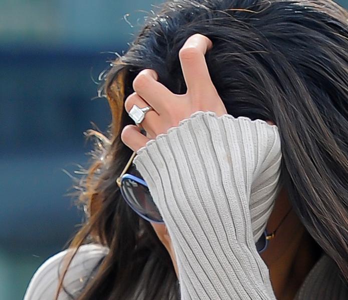 George Clooney&#8217;s fiance, Amal Alamuddin arrives at Heathrow Airport wearing her 450,000 pound ring