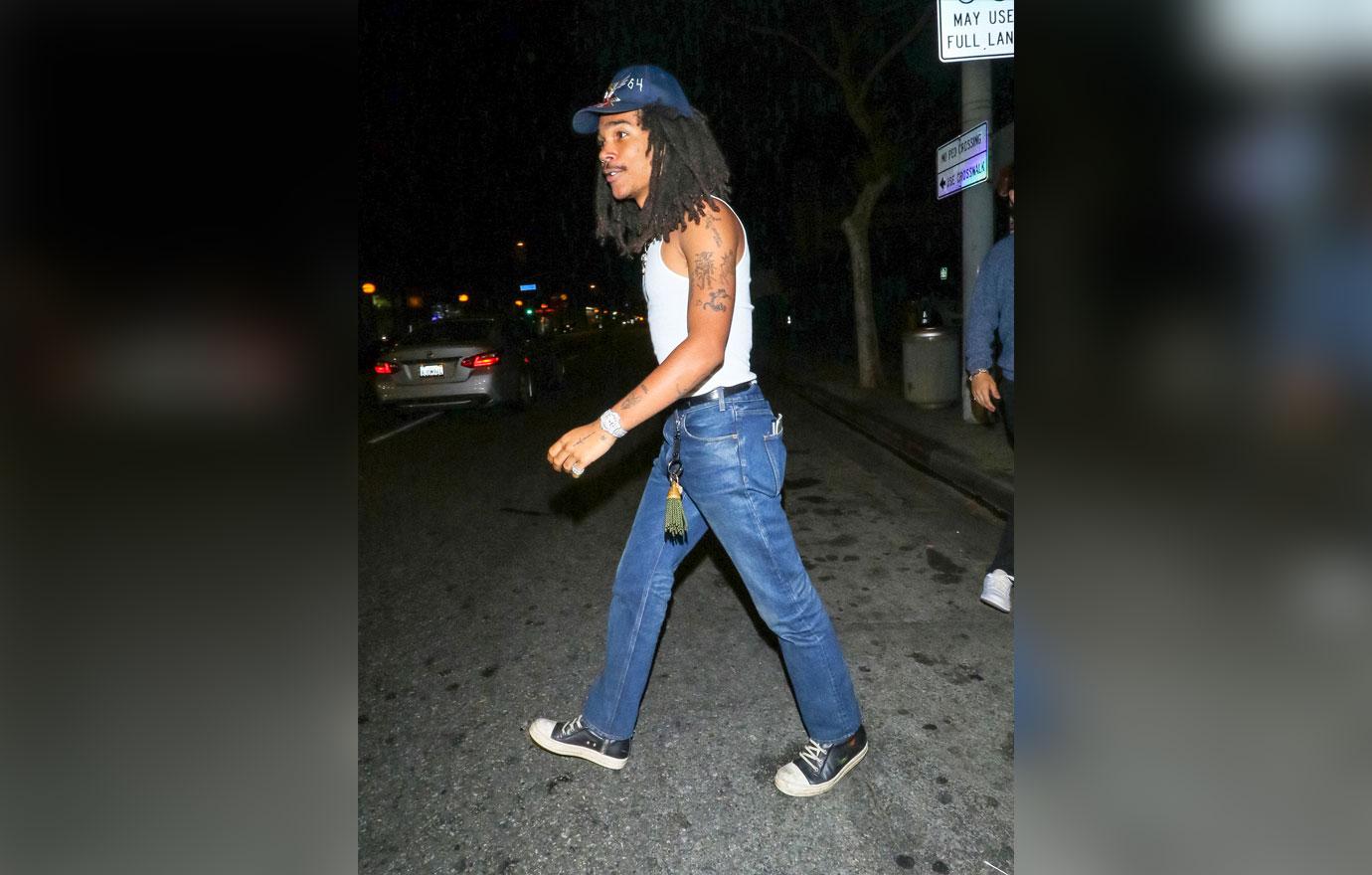 Luka Sabbat wearing White Tank, Blue Jeans, Black and White