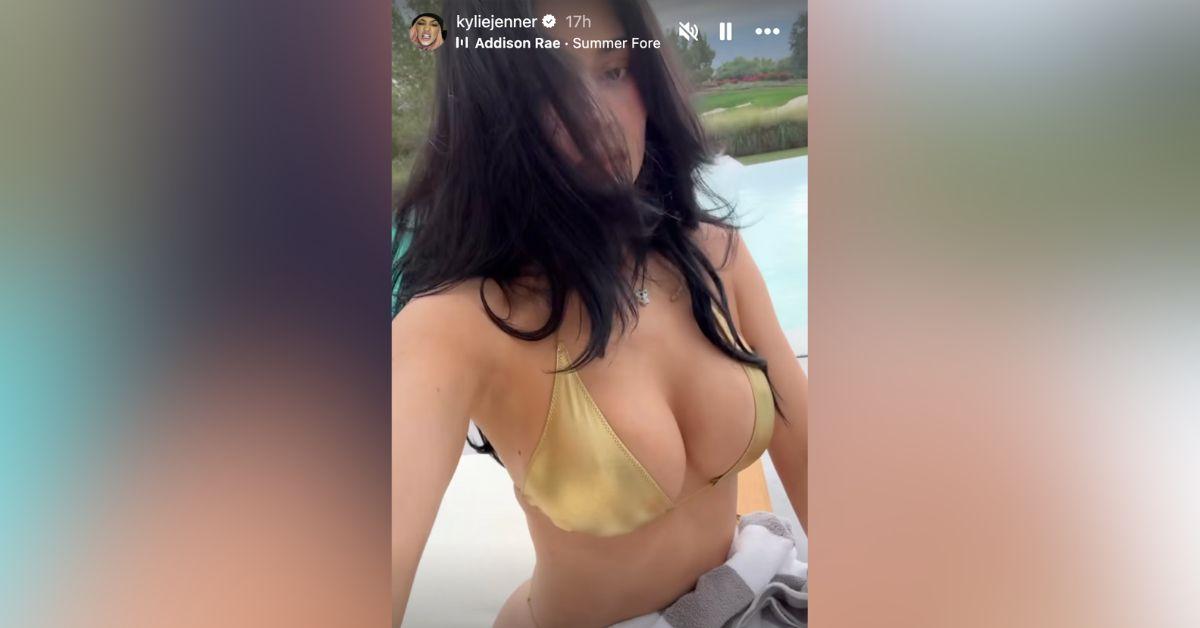 Image of Kylie Jenner lounged poolside in a bathing suit.