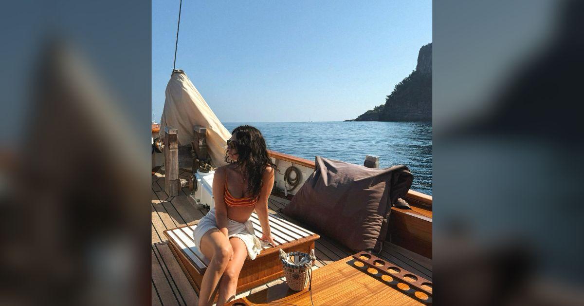 Image of Lily James enjoyed the sun on a boat.
