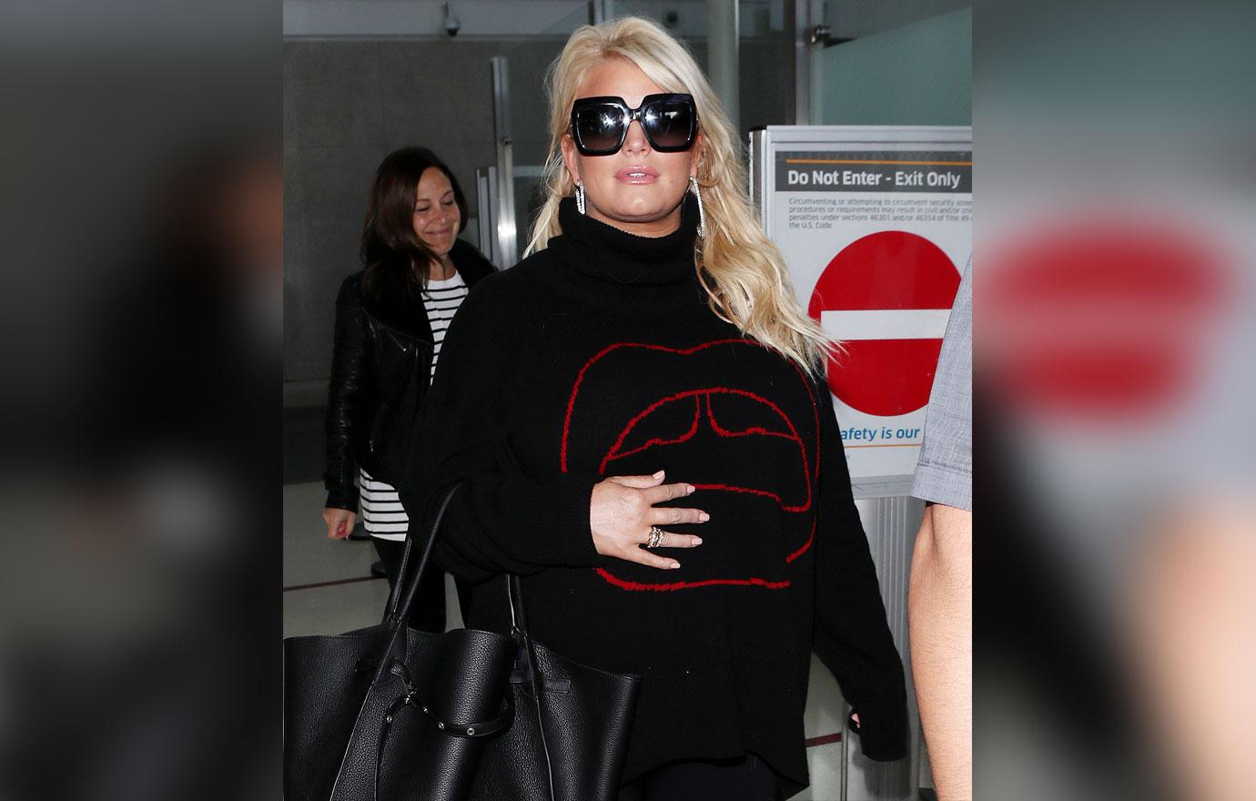 Jessica Simpson prowls around in all black while her little cub
