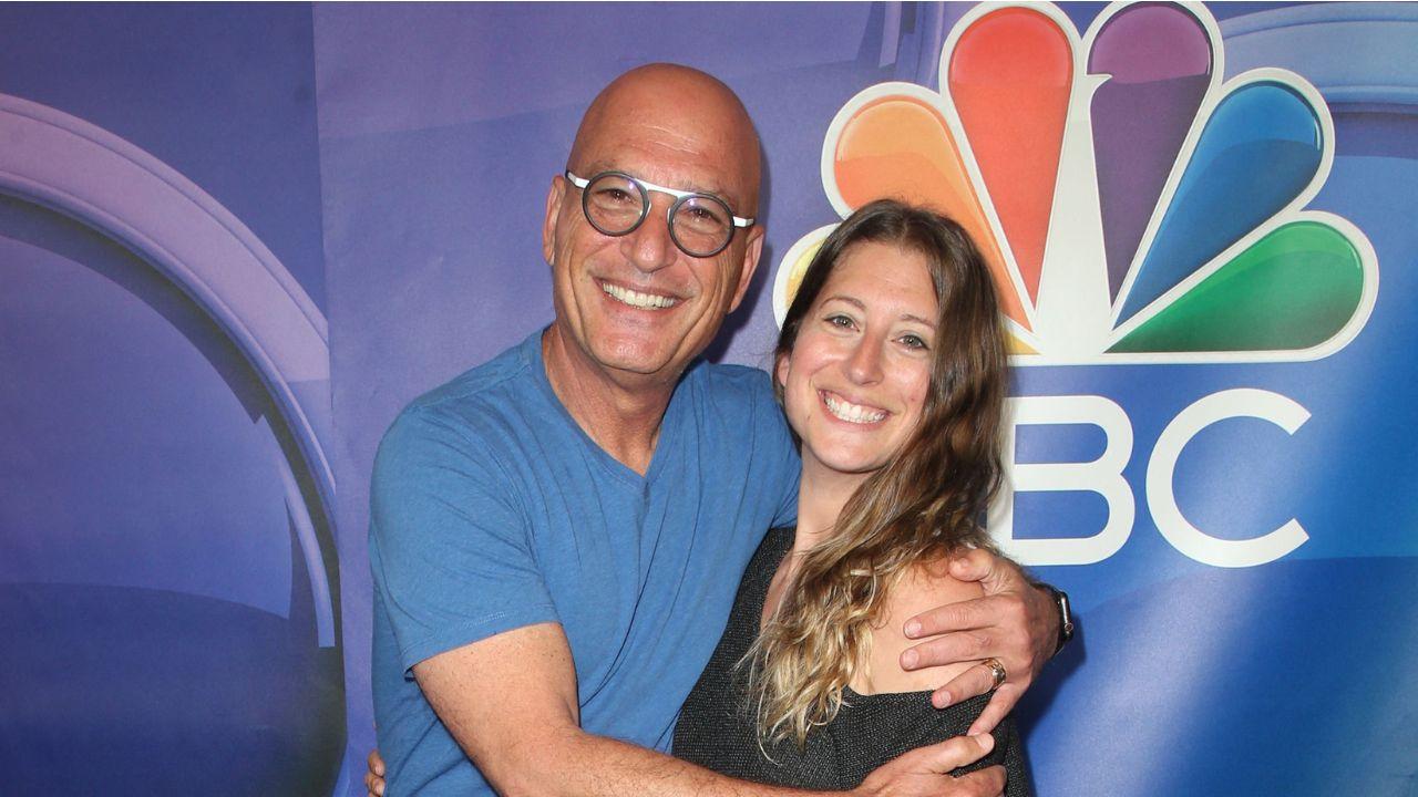 image of Howie Mandel appeared to continue the joke on social media by sharing a photo of his wife, Terry, holding $25 while wearing a glove.