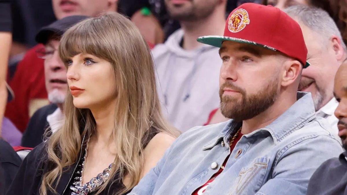 Photo of Taylor Swift giggled as fiancé Travis Kelce chugged beer at the May 23 game.