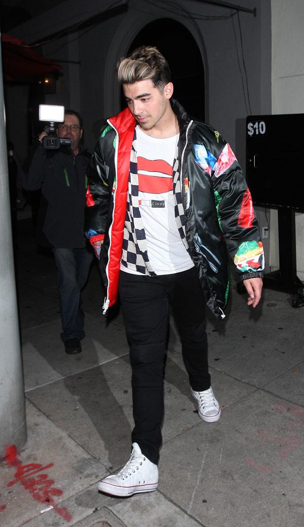 joe jonas frowns looks sad blocked ocars after party