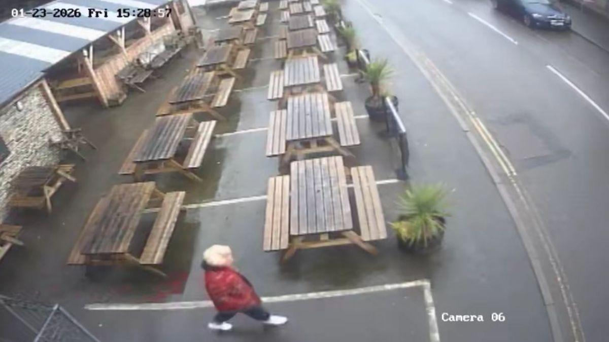 Image of The missing chef wore a red patterned jacket, blue jeans and white sneakers.