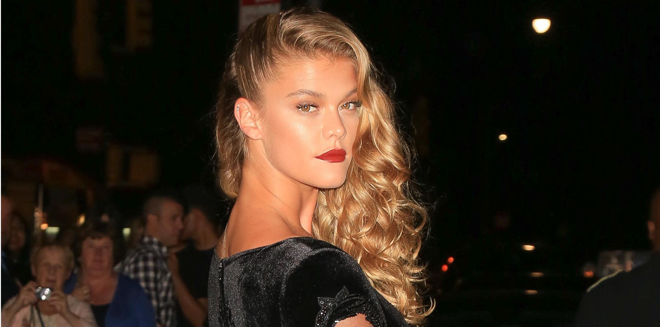 Nina Agdal shows it off as she arrives at the Harpers Bazaar party