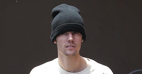 Justin Bieber Wearing Hat and Oversize Smiley Shirt