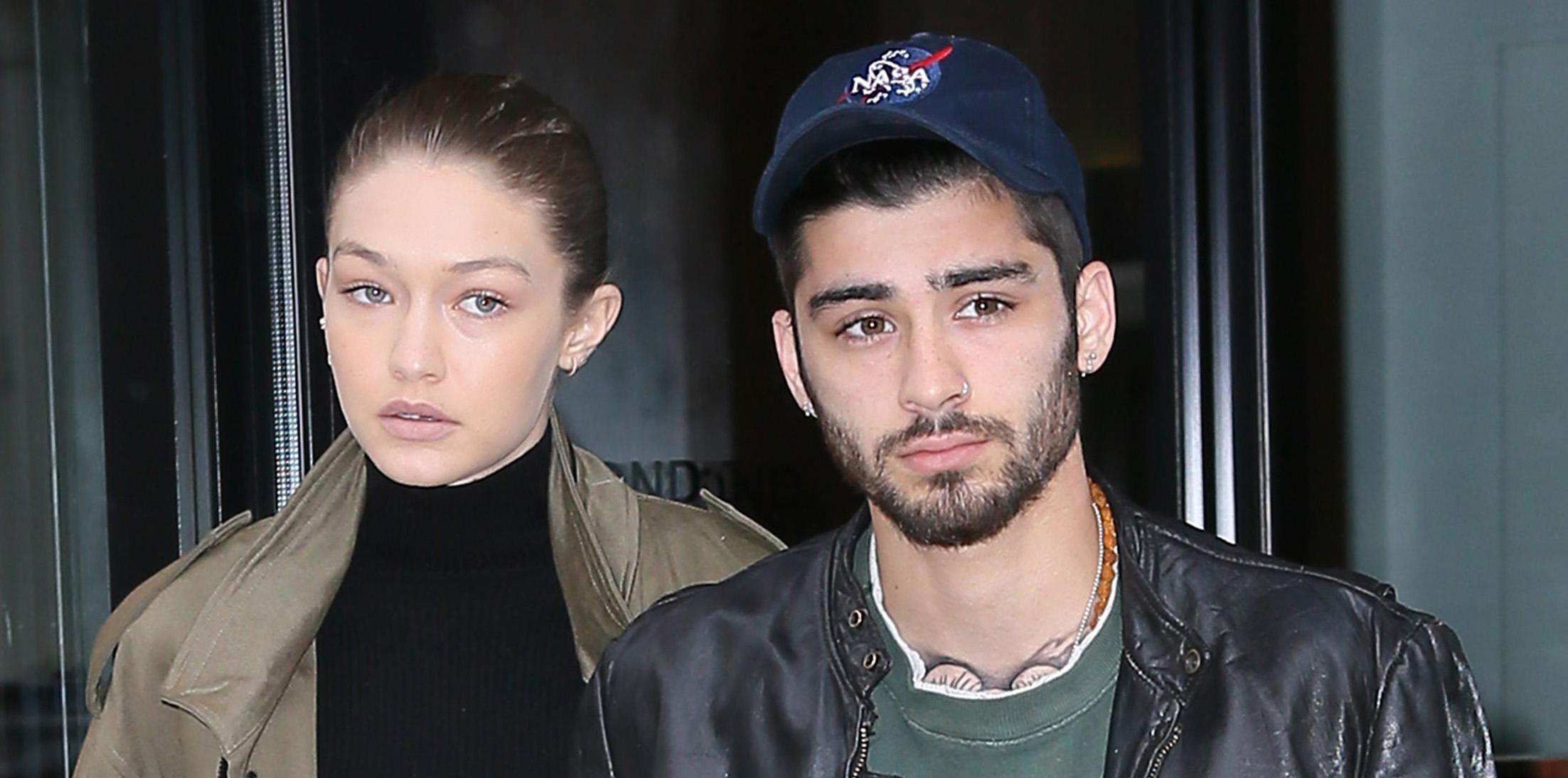 Gigi Hadid and Zayn Malik hold hands as they leave their apartment together