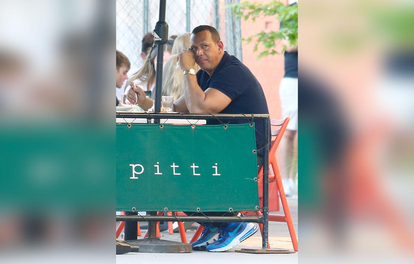 alex rodriguez looks sad as he eats alone in bar pitti