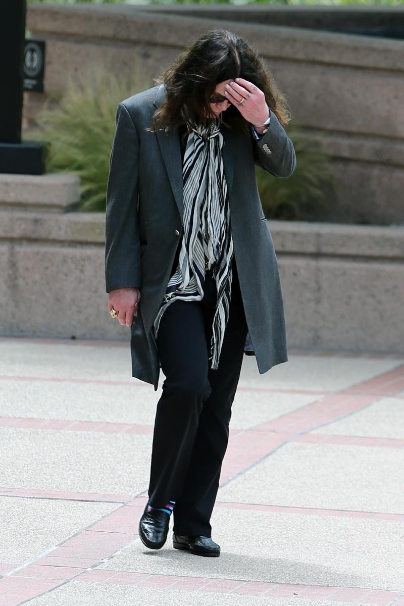 Ozzy Osbourne deep in thought as he is seen leaving the university of phoenix in costa mesa, CA with daughter Aimee Osbourne on May 10thleaving the university of phoenix in costa mesa, CA