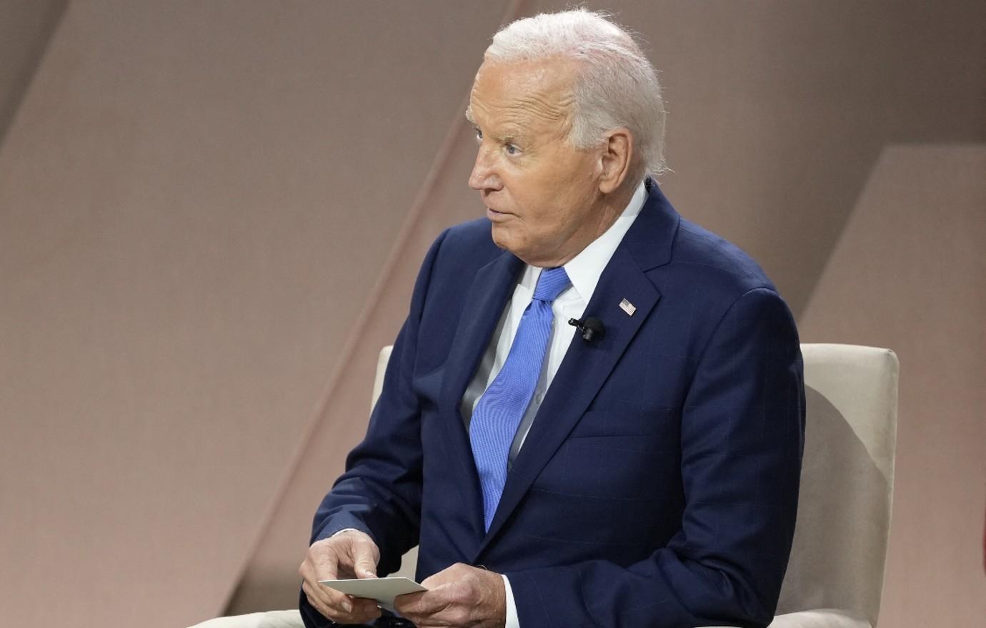 Photo of Joe Biden holding a note card.