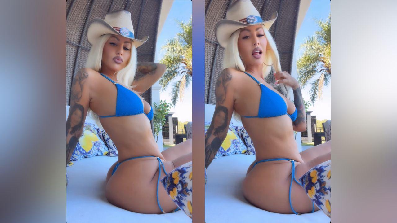 image of Amber Rose showed off her curves in a bright blue string bikini.