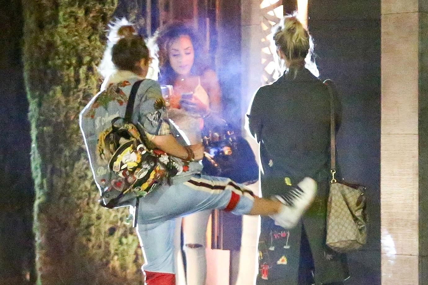 *EXCLUSIVE* Paris Jackson kicks her friend in the butt on the way out of Nobu in Malibu