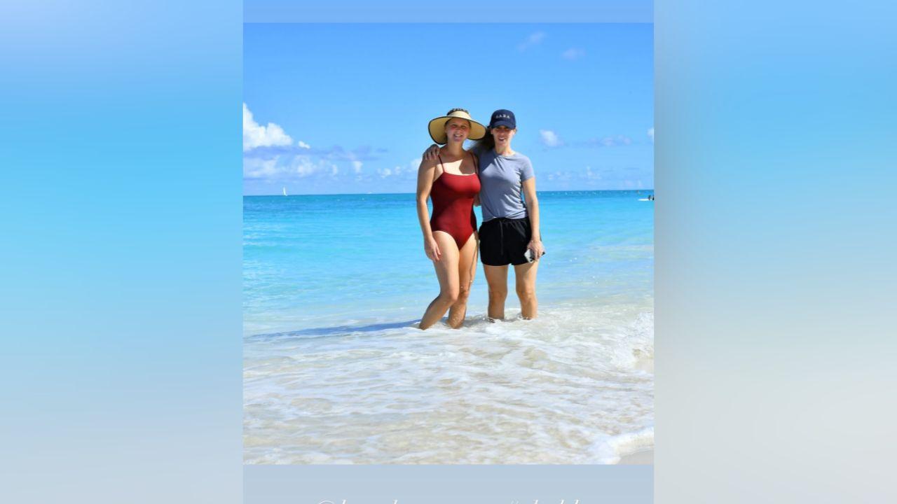 image of The comedian modeled burgundy, black and floral one-piece swimsuits during her tropical getaway.
