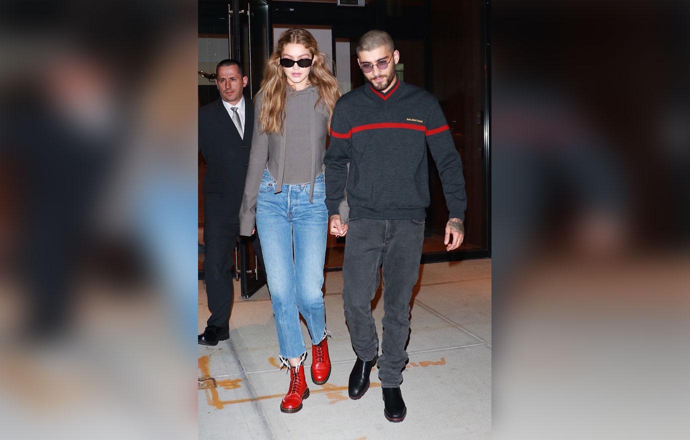 Gigi Hadid and Zayn Malik hold hands as Bella Hadid leads the way to a helipad