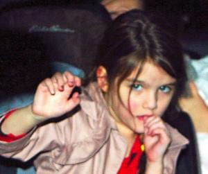 2011__03__Suri_Cruise_March17news 300×264.jpg