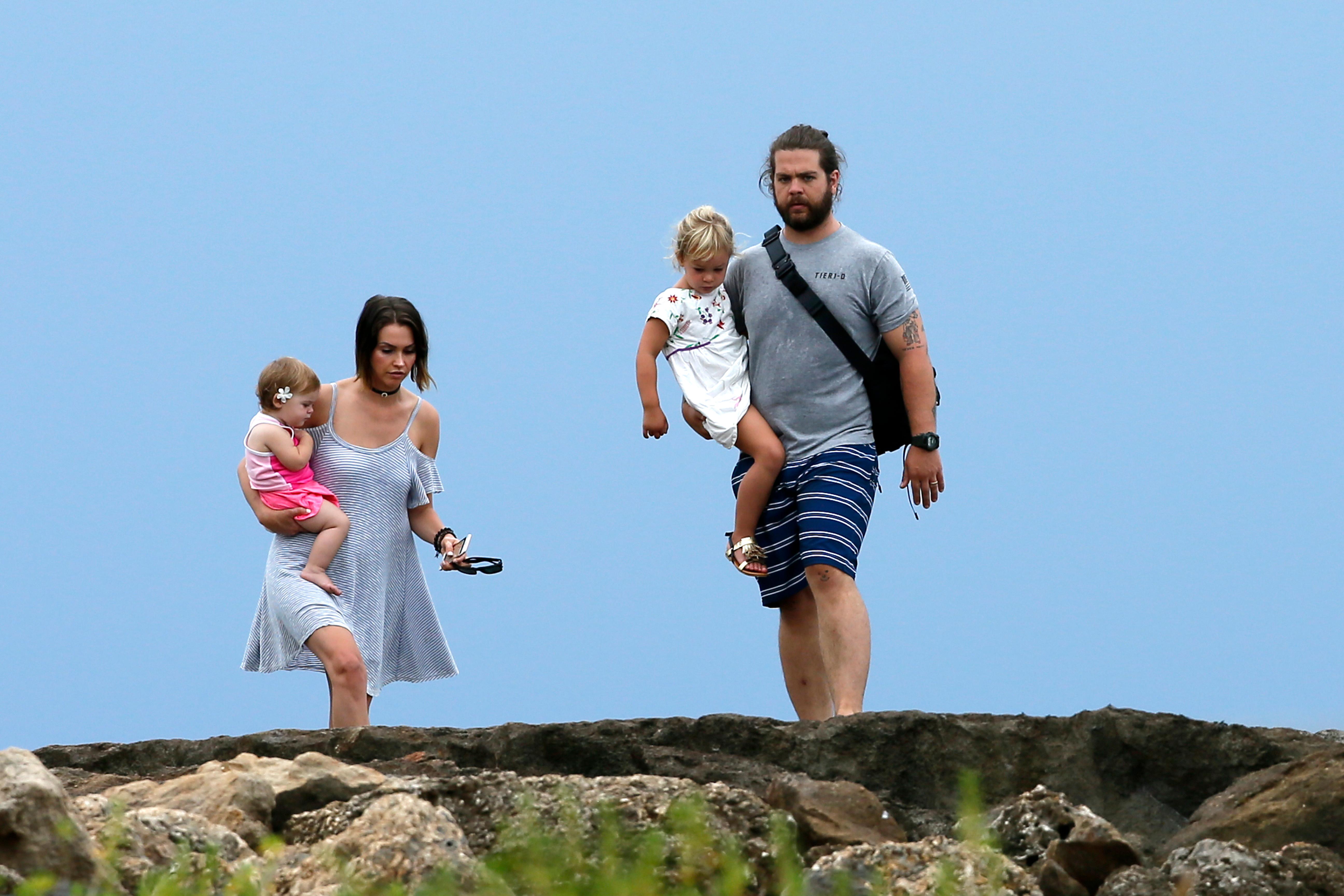 EXCLUSIVE: jack osbourne takes to the beach in Hawaii with his wife Lisa and children Pearl and Andy Rose