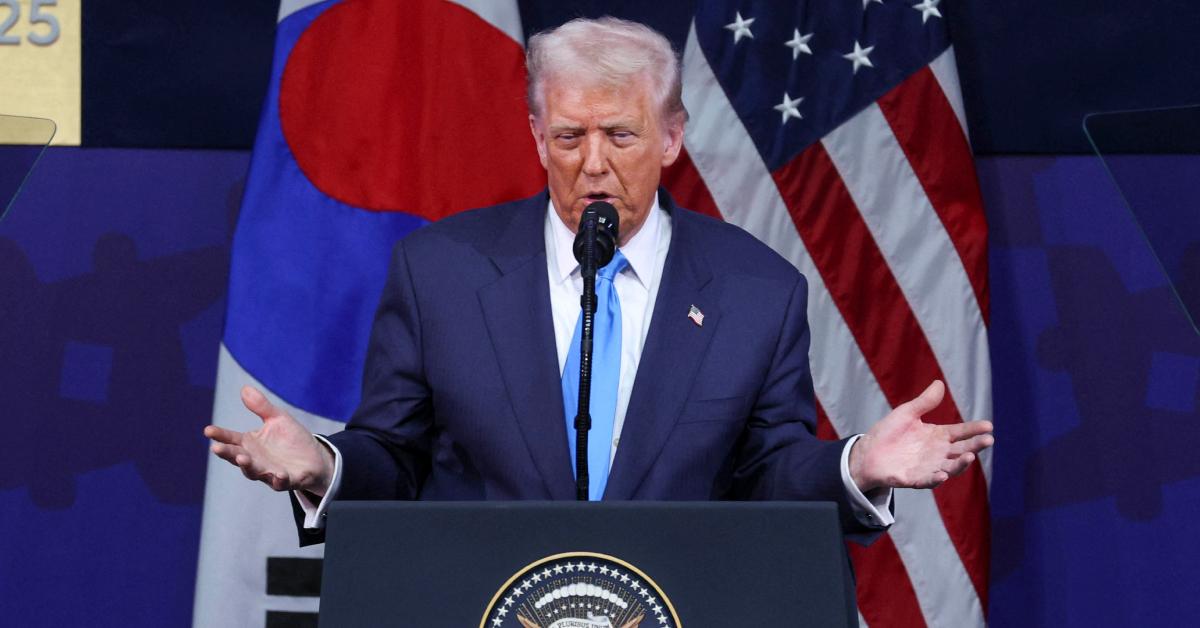 Image of Donald Trump was filmed gripping the handrail while disembarking Air Force One in Asia.