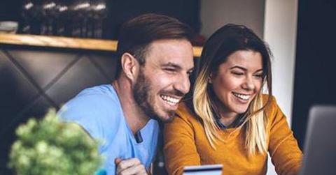 People Smiling At The Computer Cash Back Day