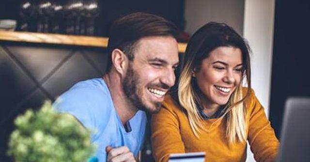 People Smiling At The Computer Cash Back Day