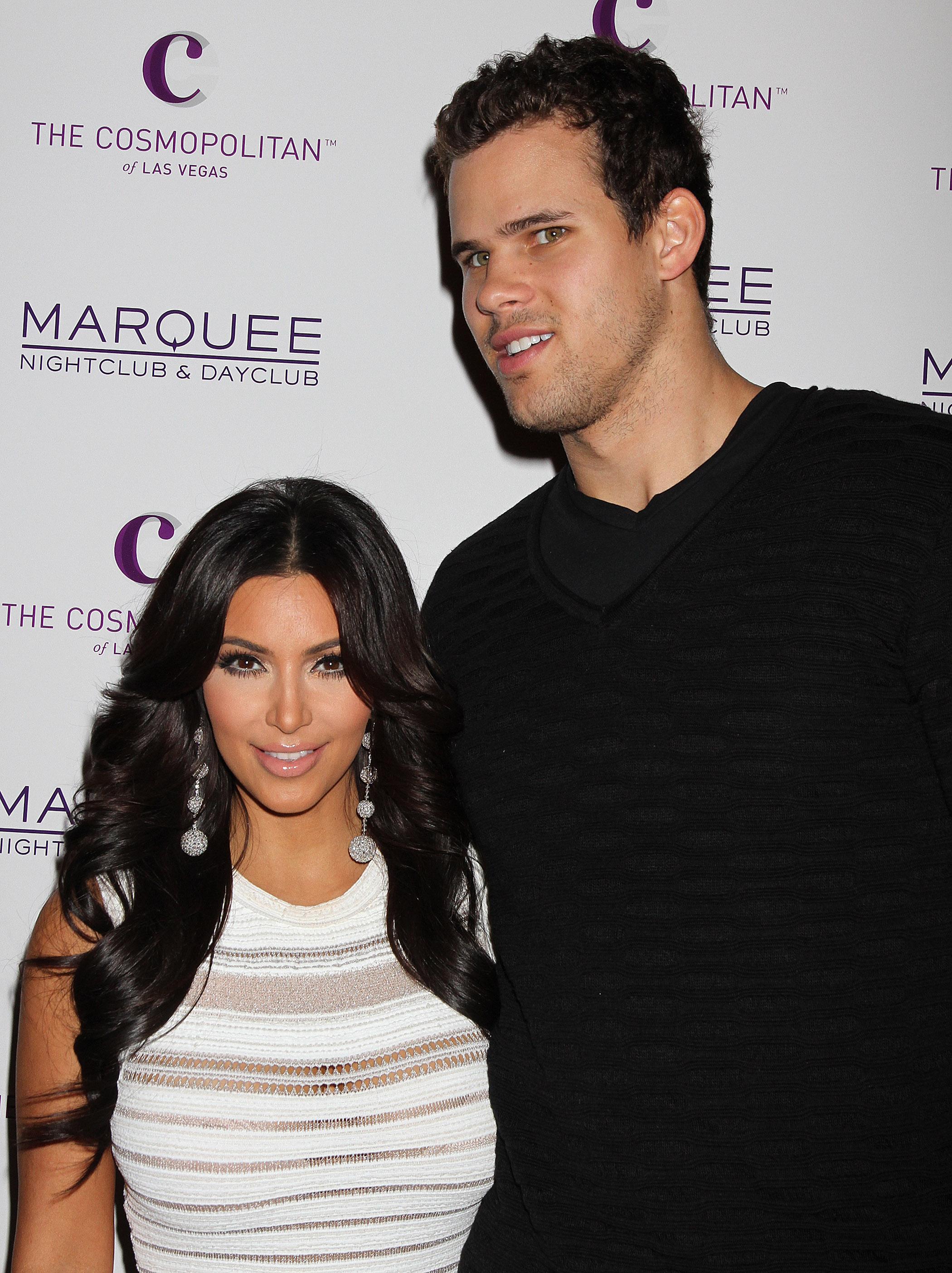 Kim Kardashian and Kris Humphries pose for a photo on the red carpet.