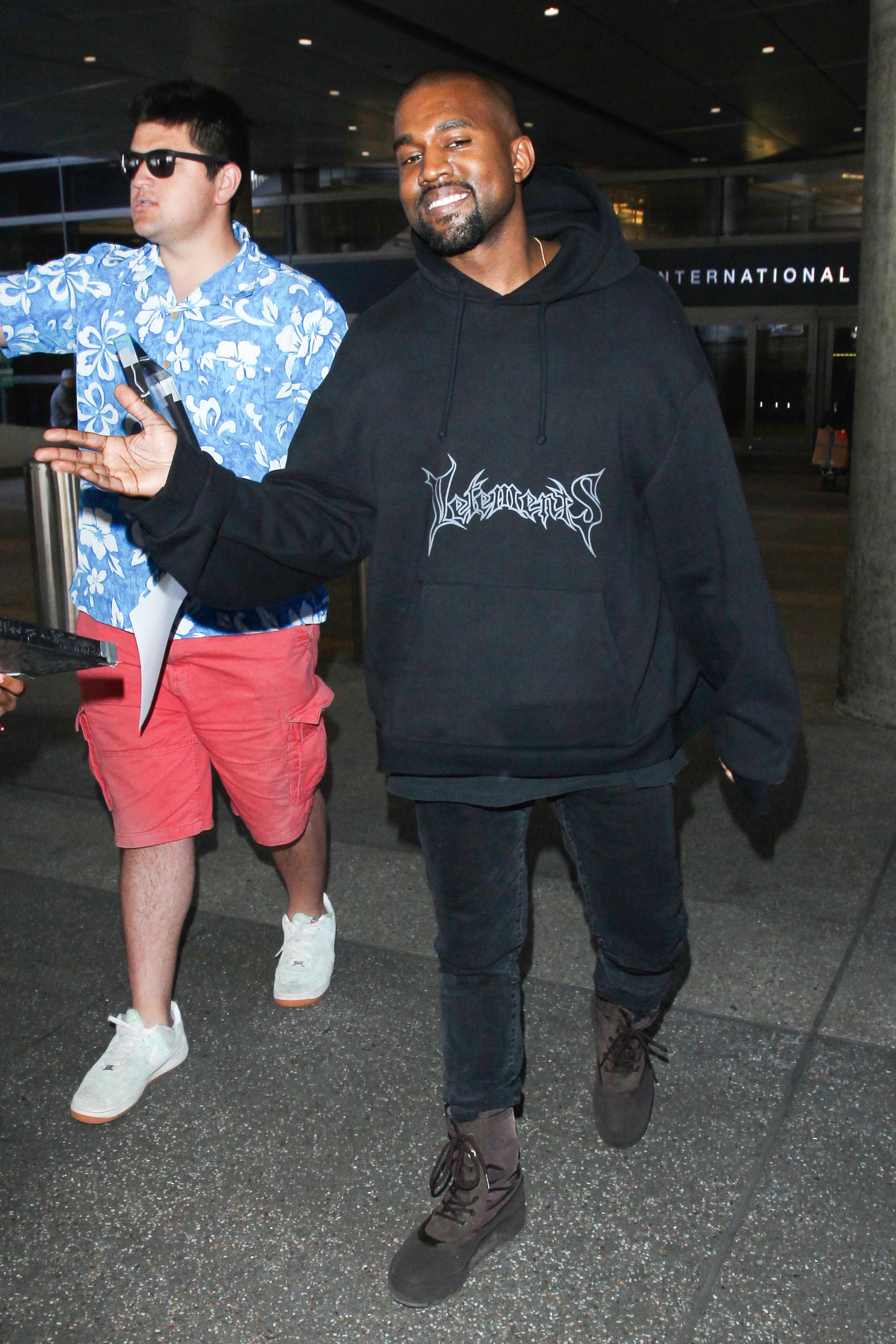 Kanye West is all smiles at LAX **USA ONLY**