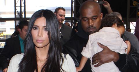 Kim Kardashian is spotted along with husband Kanye West and their young daughter North as they arrive at LAX Airport in Los Angeles, CA