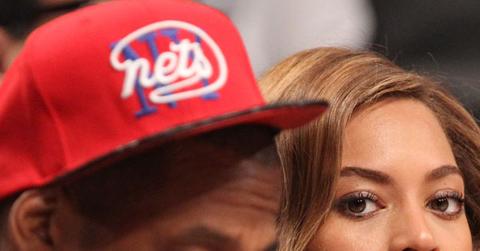 Jay Z and Beyonce sitting in the front row at the Toronto Raptors vs. Brooklyn Nets at the Barclays Center