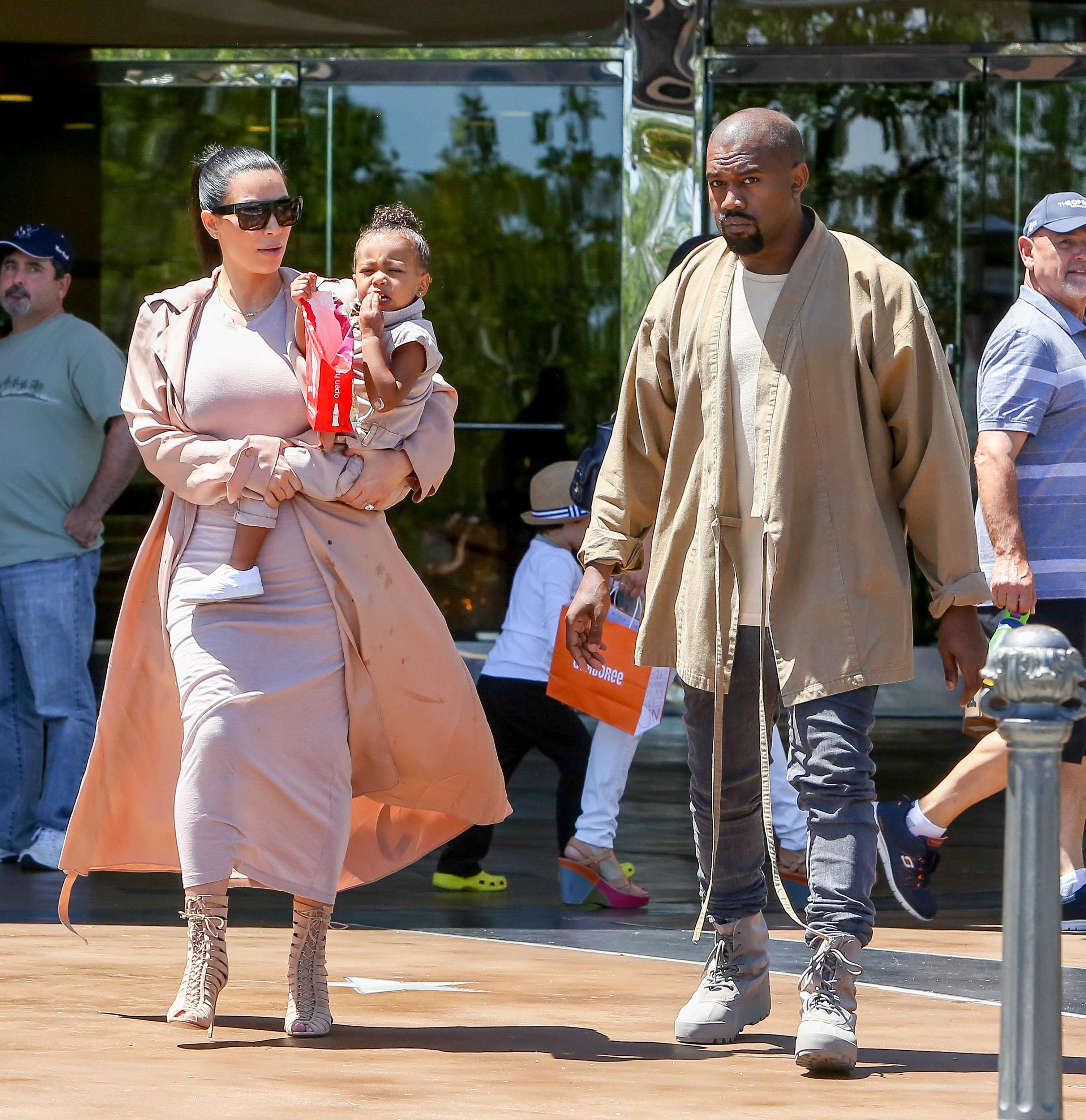 Kim Kardashian and Kanye West take their baby North West to the movies in Calabasas, CA