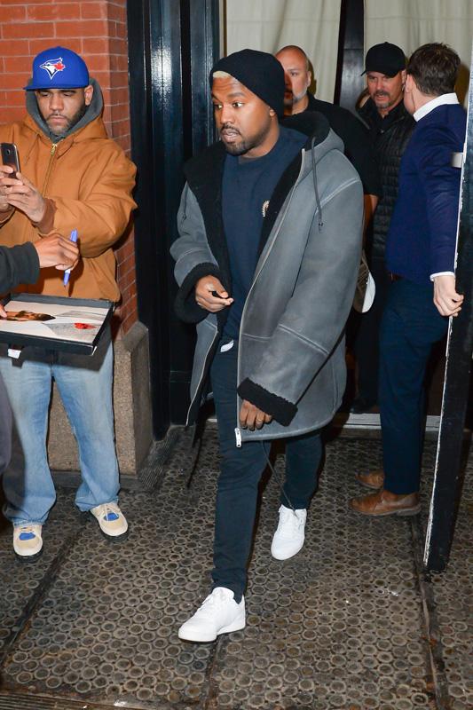 Kanye West steps out of his apartment before his fashion show starts