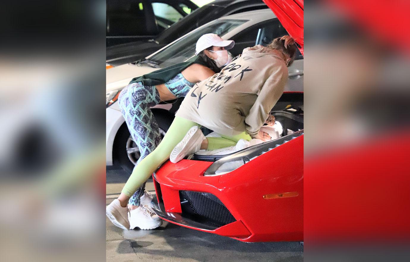 Vanessa Hudgens stuffs her Ferrari after early holiday shopping at the mall.