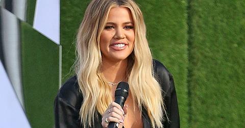Khloe kardashian cradles baby bump