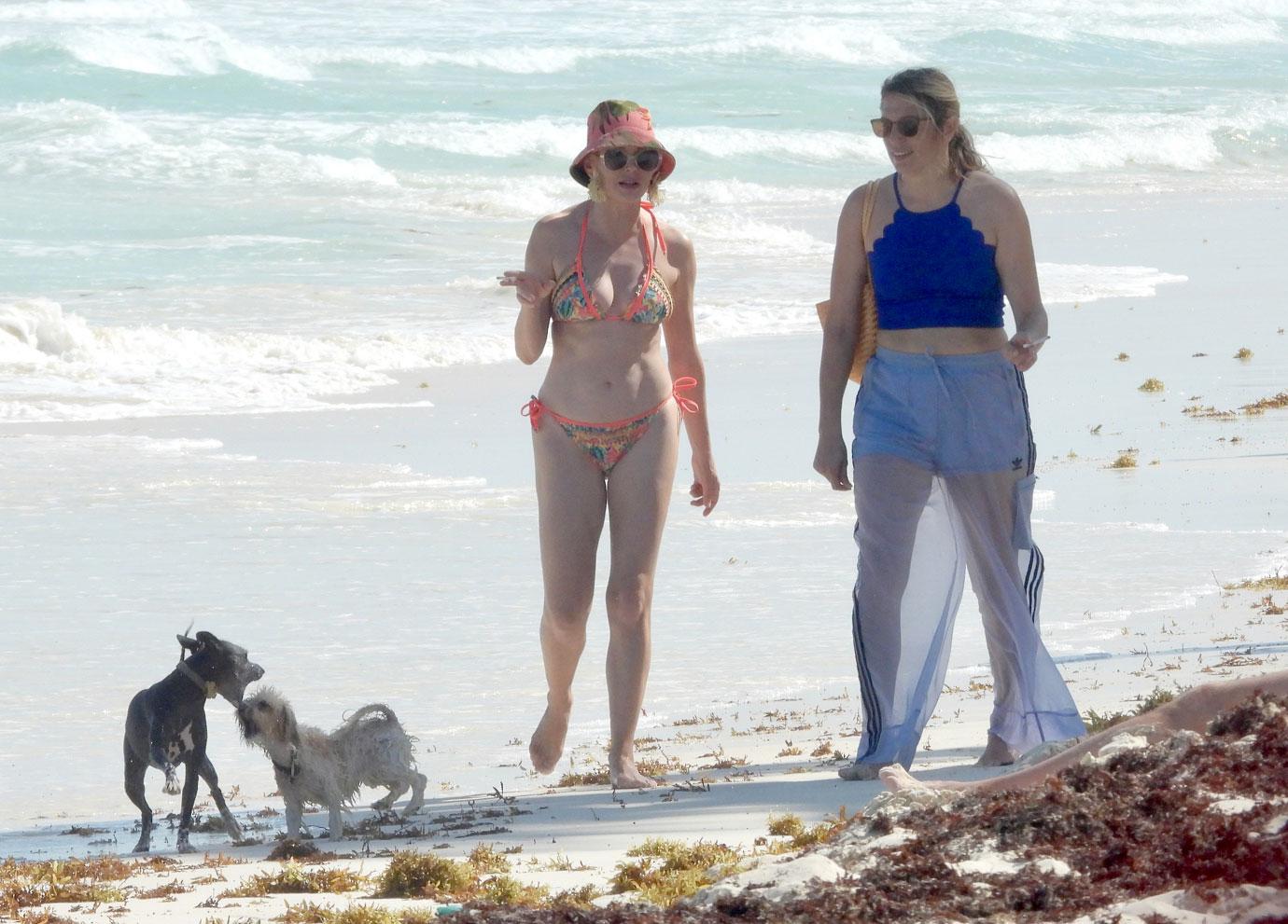 rose mcgowan hits the beach in mexico with friend