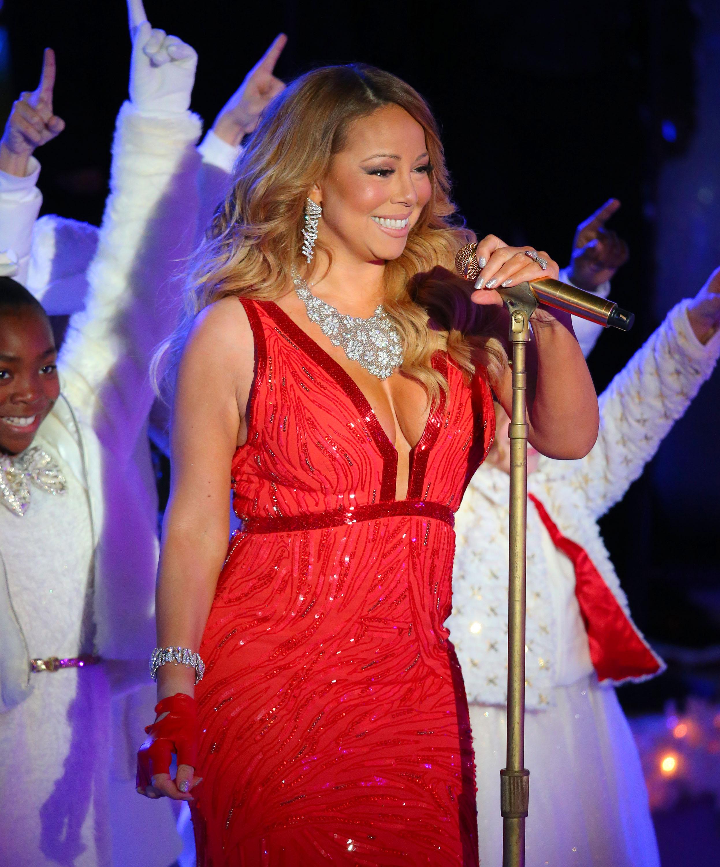 Mariah Carey looks ravishing in red at the Rockefeller Center Christmas Tree lighting event
