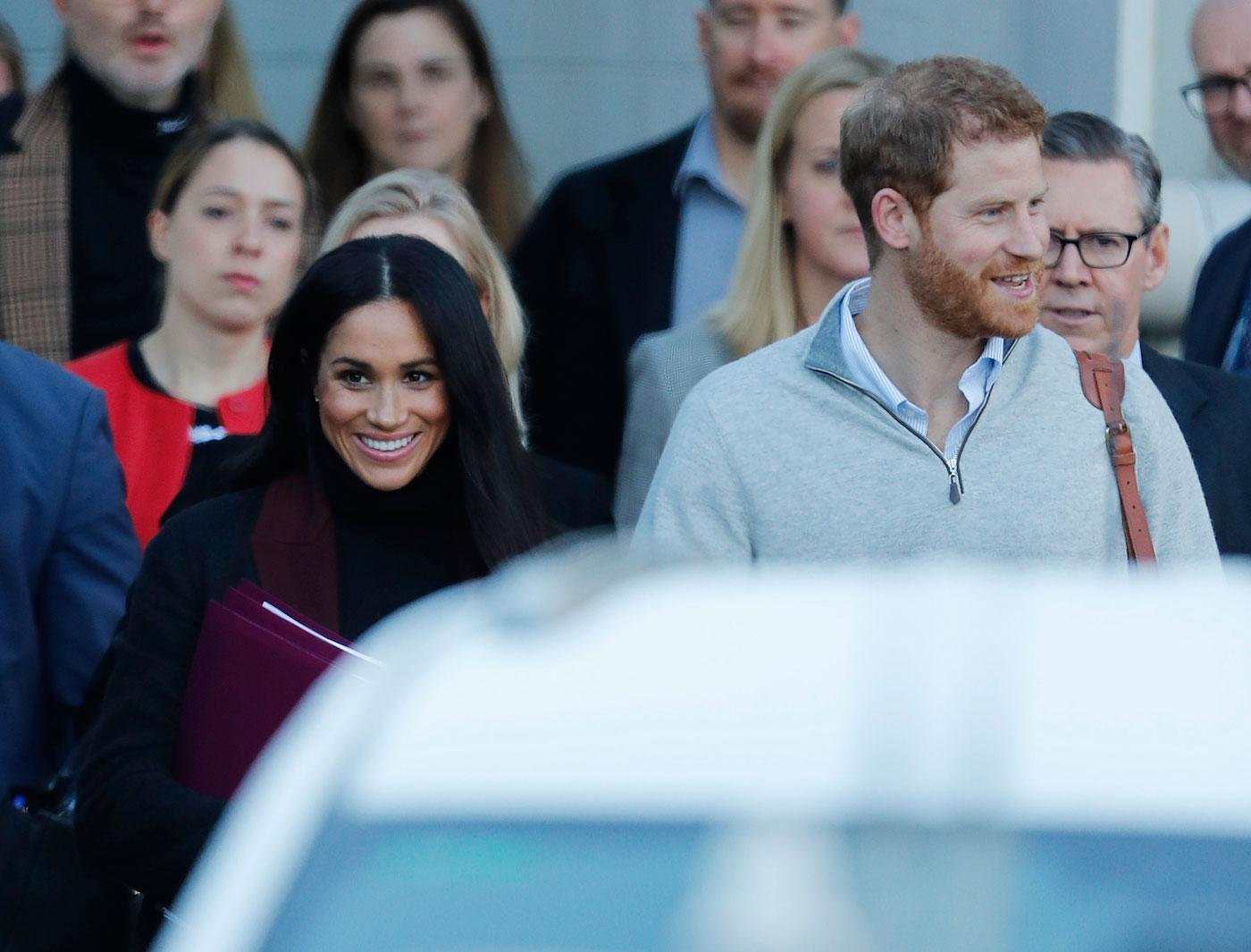 Prince Harry and his wife Meghan Markle pictured arriving in Sydney.