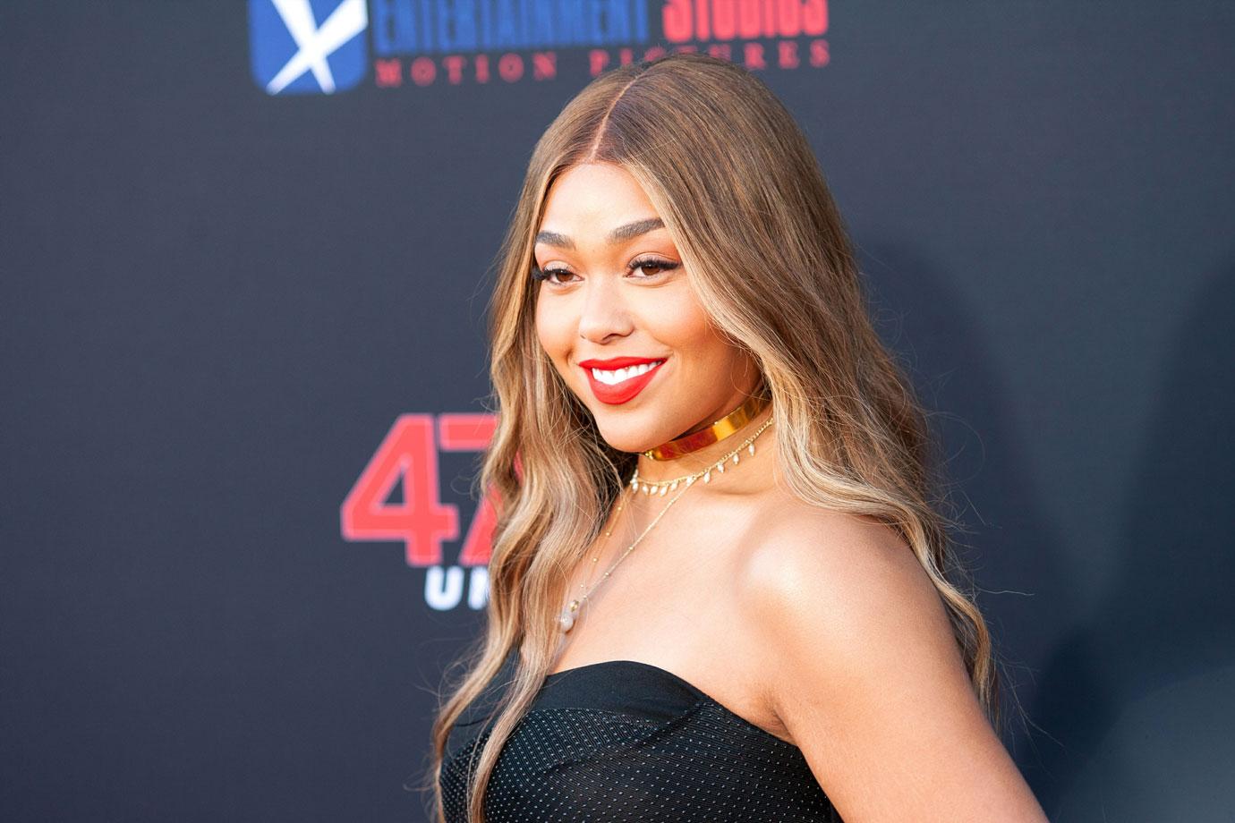 Jordyn Woods Wearing Strapless Dress On Red Carpet