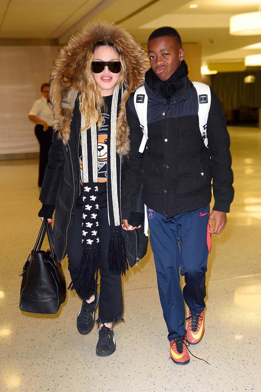 *EXCLUSIVE* Madonna walks hand in hand with son David Banda at JFK airport