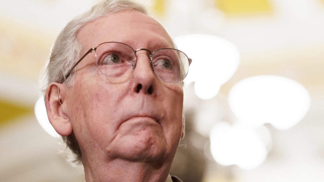 photo of Mitch McConnell returned to the Senate floor in a wheelchair.