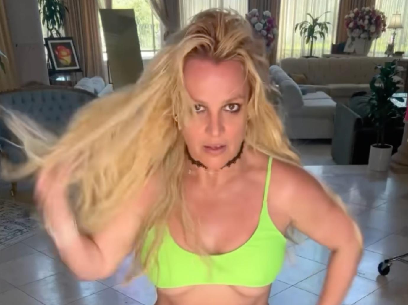 britney spears dancing skimpy neon bikini broken bone foot video