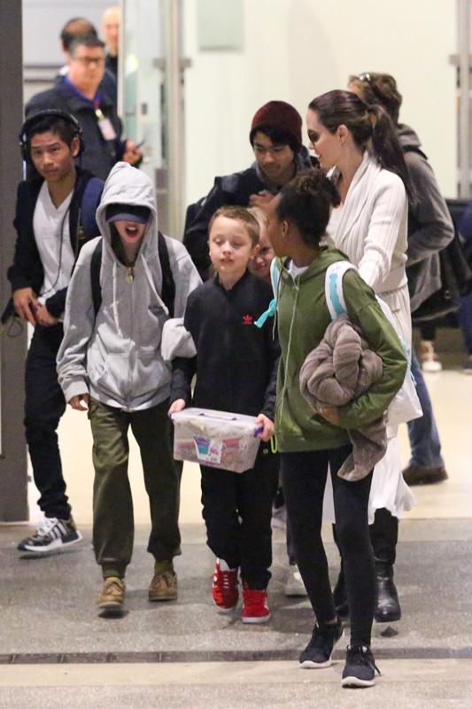 Angelina Jolie touches down at LAX with her brood