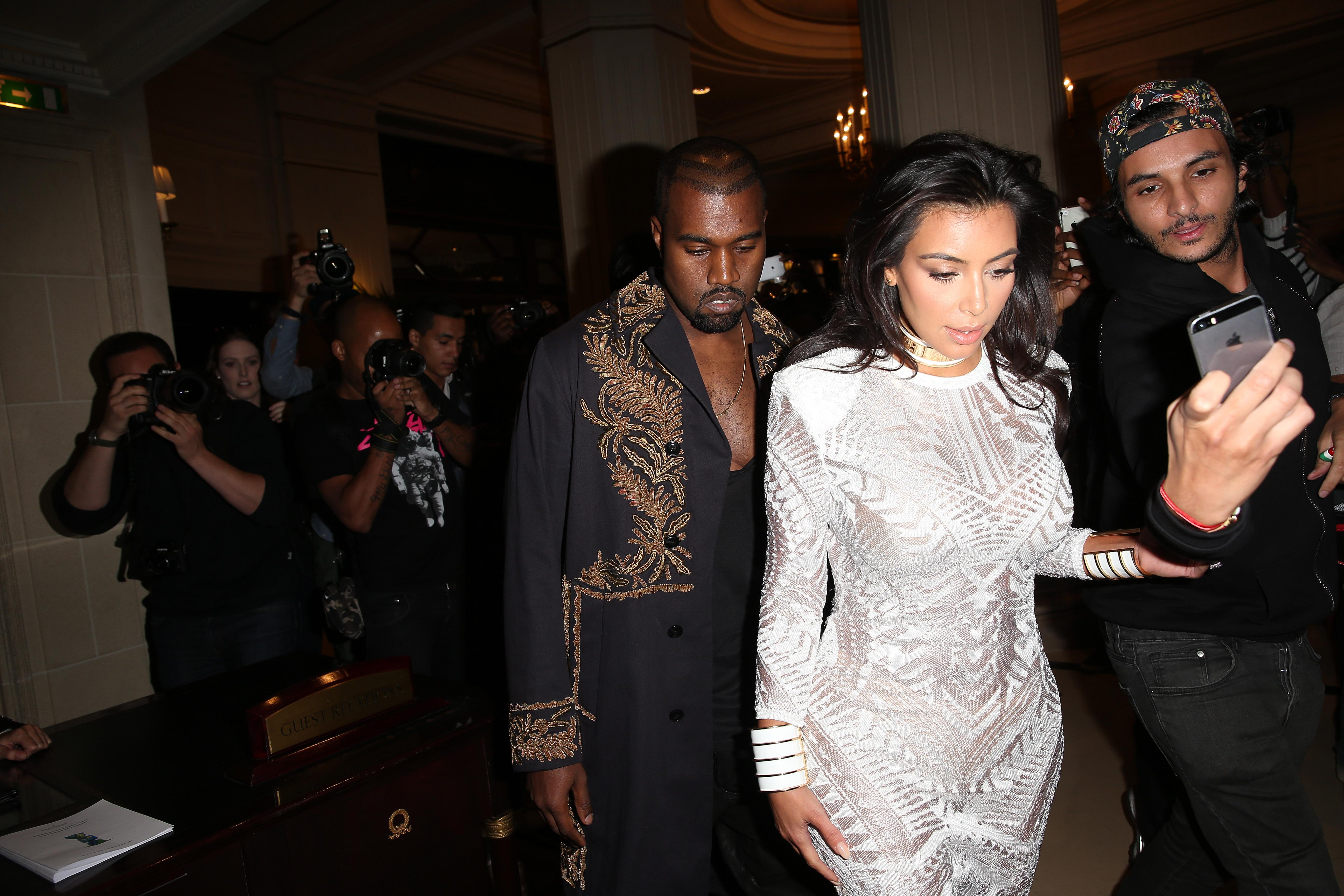 Kim Kardashian and Kanye West arrive at the Grand Hotel, Paris