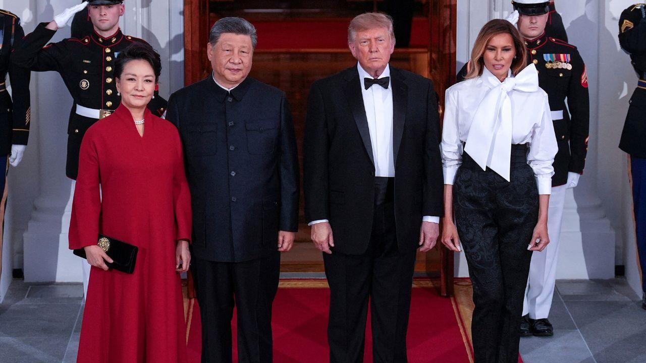 Image of Melania Trump's office oversaw the state dinner decorations, which featured red linens, Reagan-era vermeil and crimson dahlias.