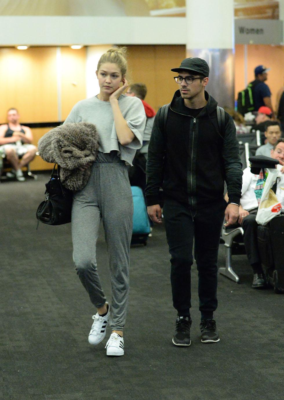 *EXCLUSIVE* Gigi Hadid and Joe Jonas affectionate as they depart LAX **NO UK**