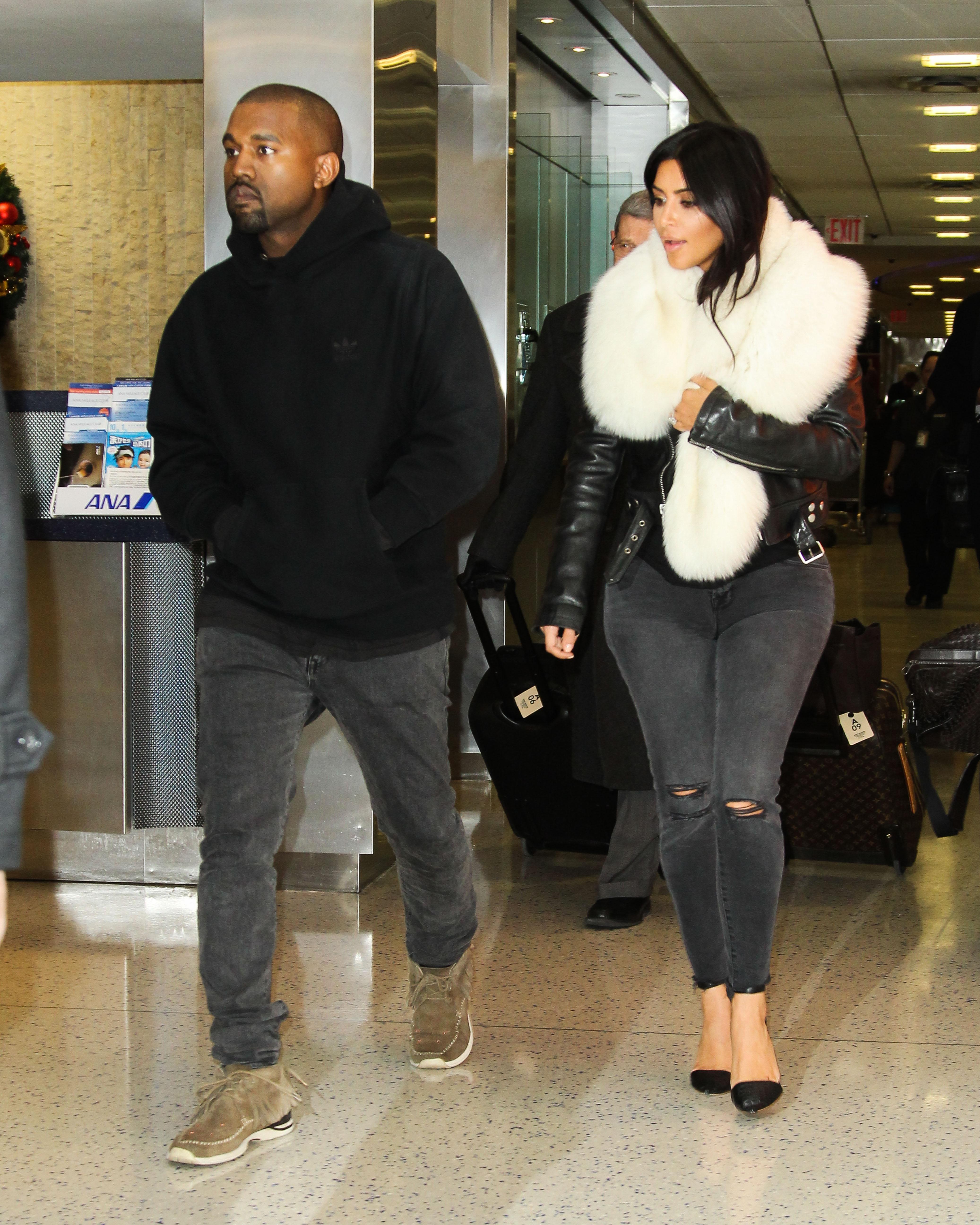 Kim Kardashian and Kanye West are seen arriving at JFK Airport