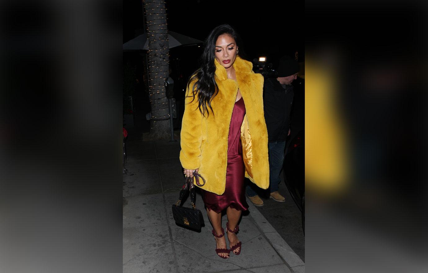 Nicole Scherzinger stays warm in a yellow fur coat as she leaves Madeo restaurant after having dinner