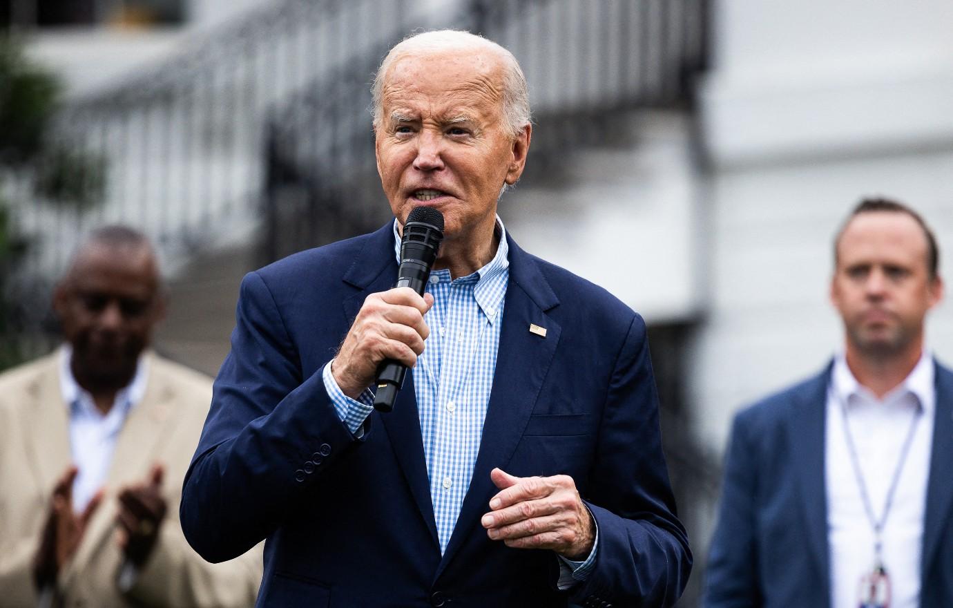 Photo of President Joe Biden with microphone.