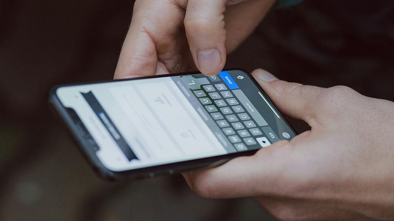 Image of person holding phone 