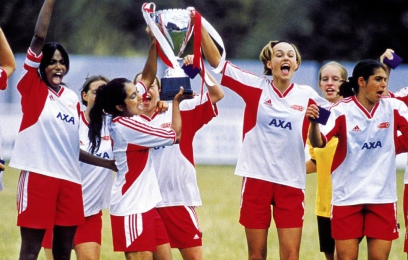 Parminder Nagra and Keira Knightley, in their soccer uniforms, shared a triumphant moment in Bend it Like Beckham.