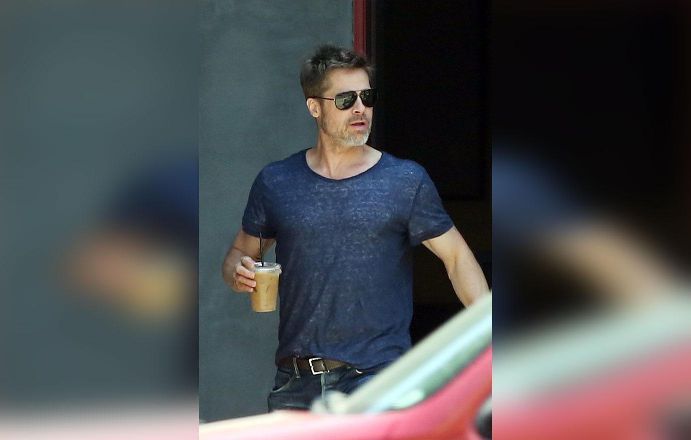 Brad Pitt takes home a iced coffee after lunch