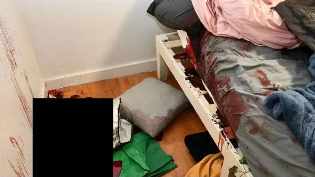 image of Crime scene photos show blood-soaked bed sheets and blood smeared on the wall.